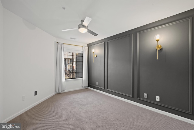 empty room with light carpet and ceiling fan