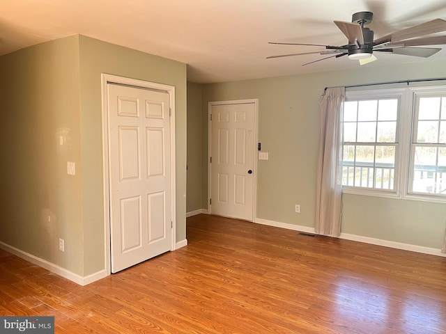 interior space with ceiling fan and light hardwood / wood-style flooring