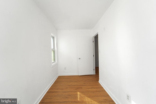 corridor featuring hardwood / wood-style floors