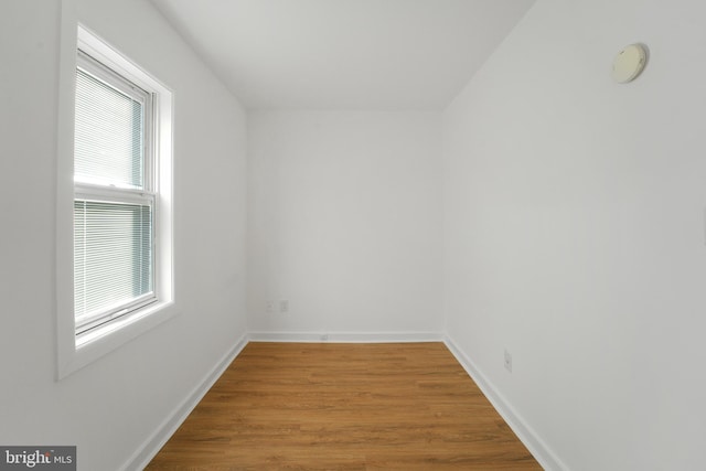 empty room with hardwood / wood-style floors