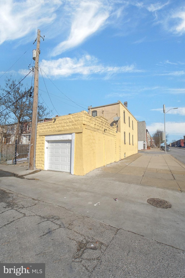 view of side of home featuring a garage