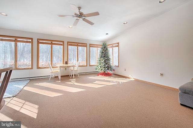 interior space featuring vaulted ceiling, carpet, and ceiling fan