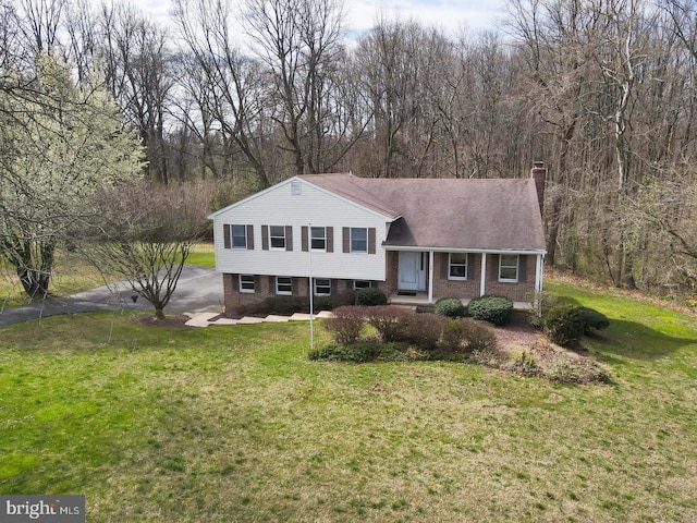 split level home with a front yard