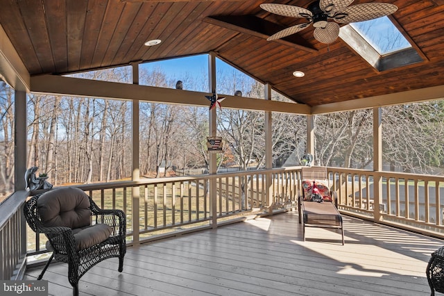 wooden terrace featuring ceiling fan