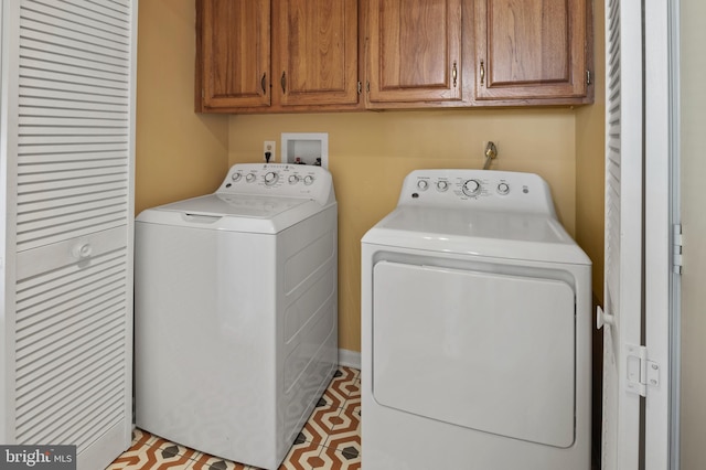 laundry area with cabinets and independent washer and dryer