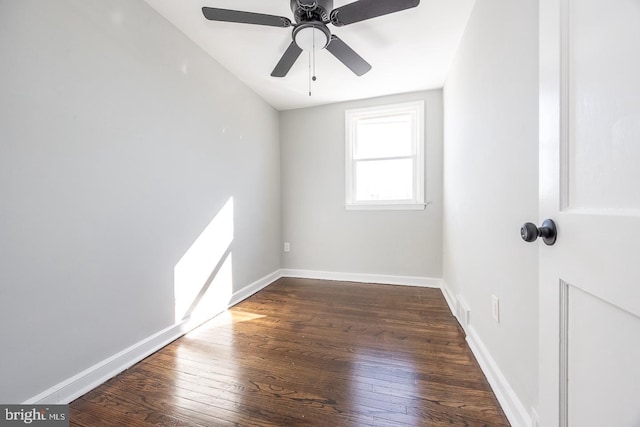 spare room featuring ceiling fan and dark hardwood / wood-style flooring