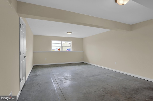 spare room featuring beam ceiling