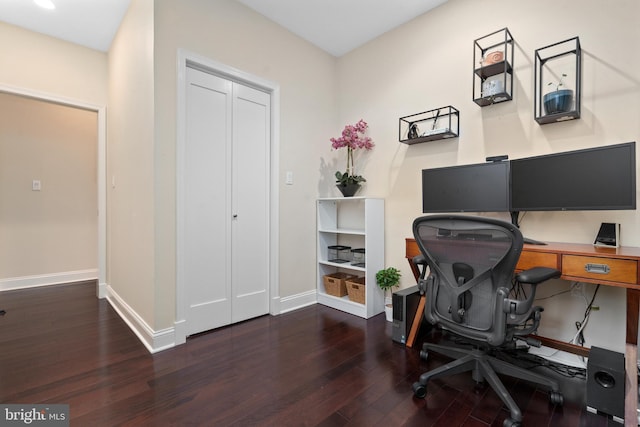 home office with dark wood-type flooring