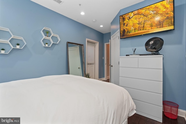 bedroom featuring dark hardwood / wood-style flooring