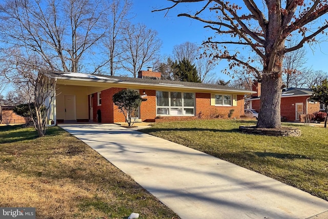 single story home featuring a front yard and a carport