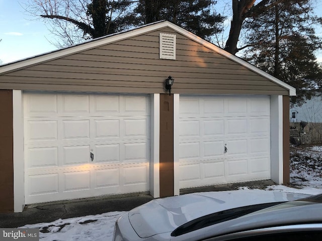 view of snow covered garage