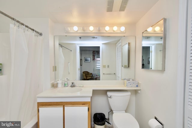 bathroom featuring vanity and toilet