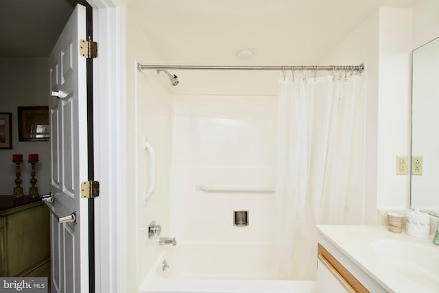 bathroom featuring vanity and shower / bath combo with shower curtain