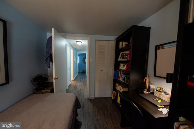 bedroom with dark wood-type flooring