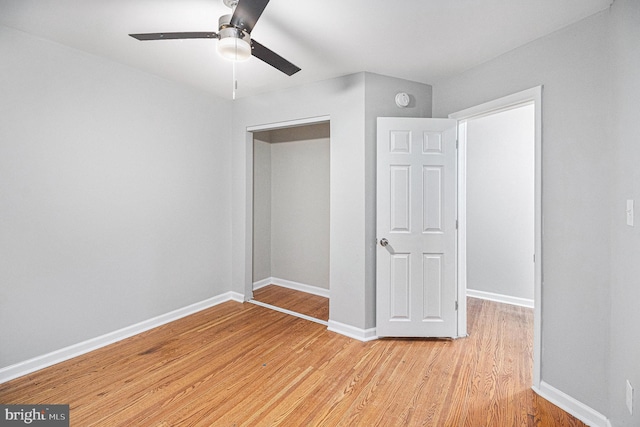 unfurnished bedroom with ceiling fan and light hardwood / wood-style flooring