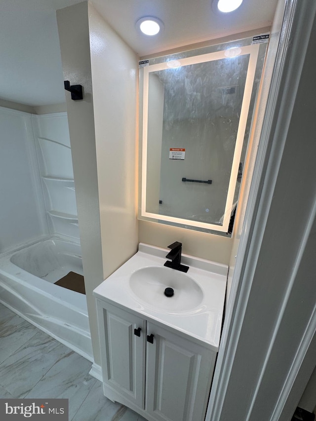 bathroom with vanity and bathing tub / shower combination