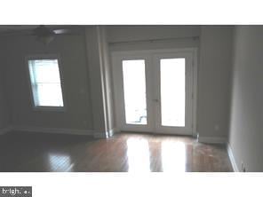 interior space featuring dark hardwood / wood-style flooring and french doors