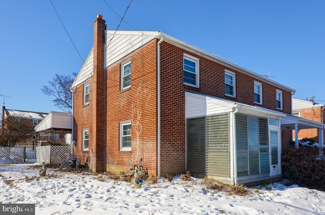 view of snow covered house