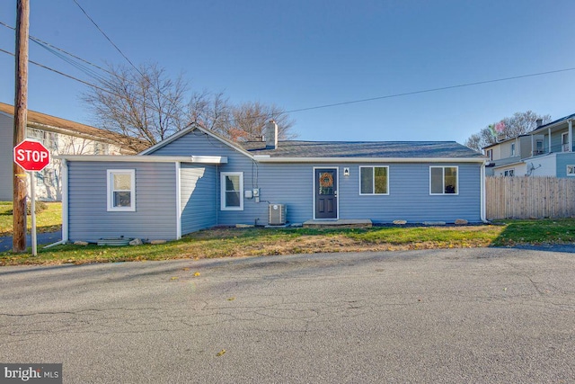 ranch-style house with central air condition unit