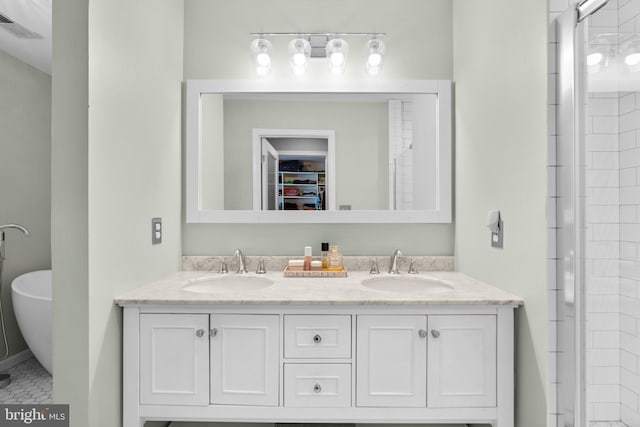 bathroom featuring vanity and an enclosed shower