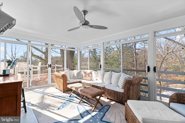 sunroom featuring ceiling fan and a healthy amount of sunlight