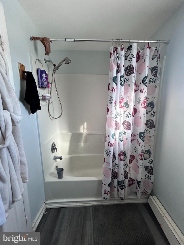 bathroom with hardwood / wood-style floors and shower / bath combo