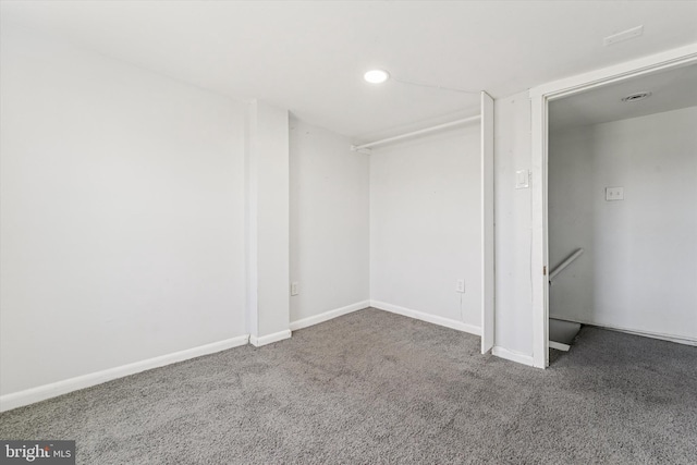 interior space featuring recessed lighting, baseboards, and carpet