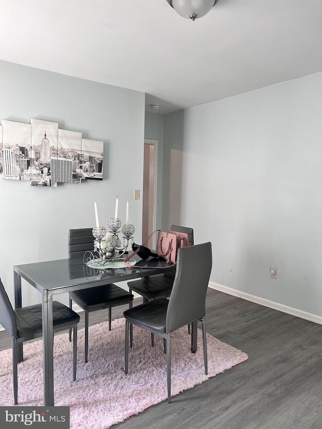 dining area featuring dark hardwood / wood-style flooring