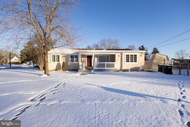 ranch-style home featuring covered porch