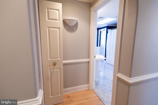 hall with light hardwood / wood-style floors