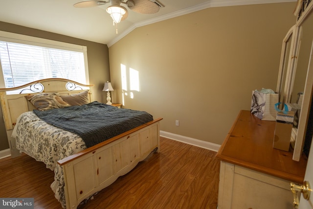 bedroom featuring ornamental molding, vaulted ceiling, and light hardwood / wood-style flooring