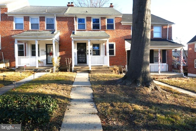 view of property featuring a porch