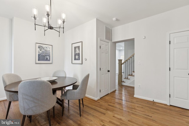 dining space with light wood-type flooring