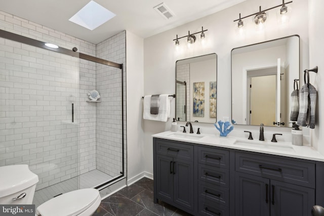 bathroom with walk in shower, vanity, toilet, and a skylight