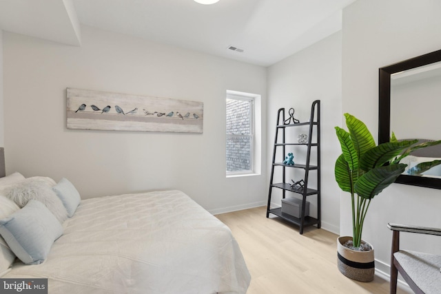 bedroom with light hardwood / wood-style flooring