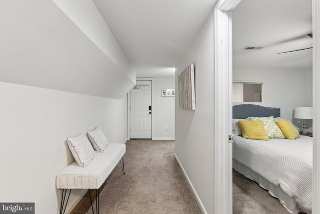 carpeted bedroom featuring vaulted ceiling