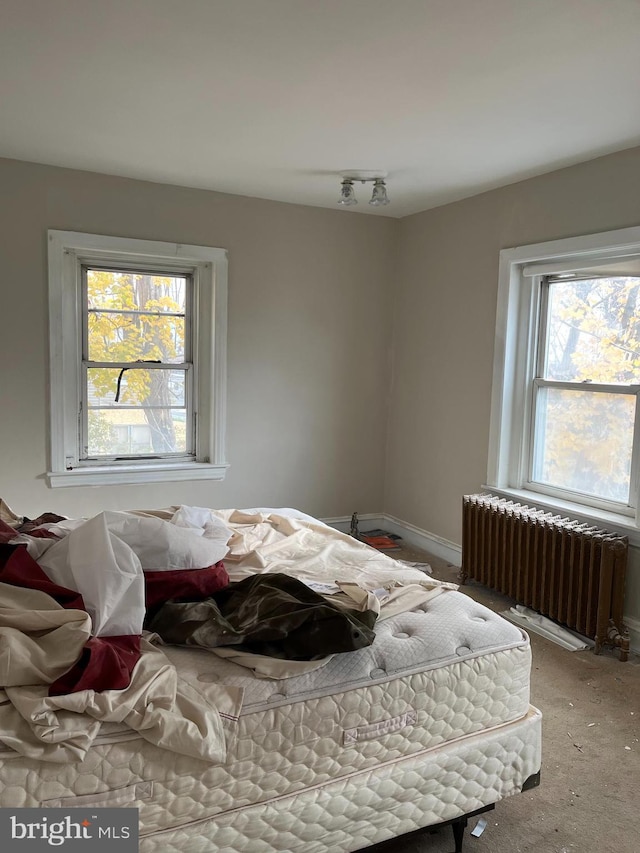 bedroom featuring radiator heating unit