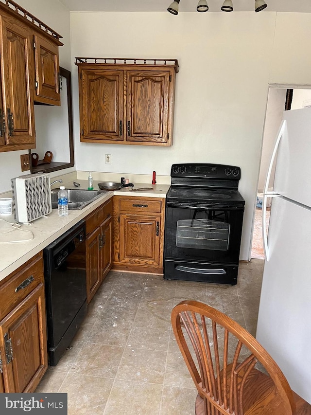 kitchen featuring sink and black appliances