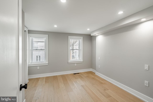 unfurnished room with light hardwood / wood-style floors