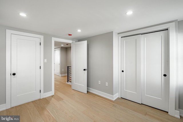 unfurnished bedroom with light hardwood / wood-style floors