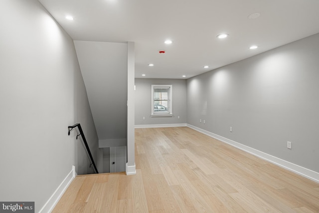 empty room with light hardwood / wood-style flooring