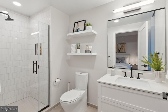 bathroom with vanity, tile patterned floors, toilet, and walk in shower