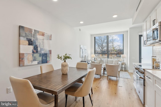 dining room with light wood-type flooring