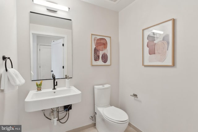 bathroom with sink and toilet