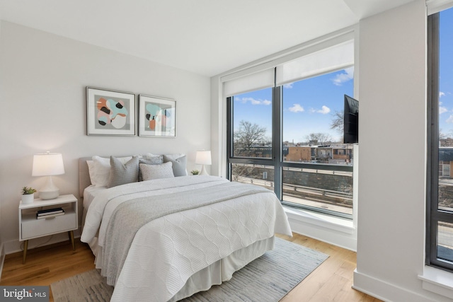 bedroom with light hardwood / wood-style floors