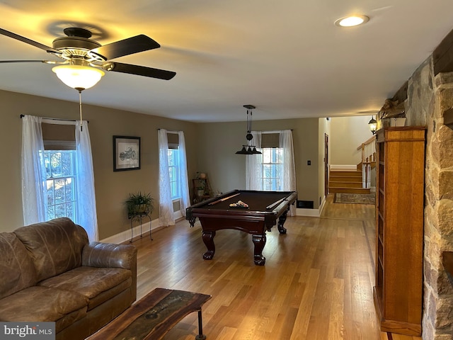 game room featuring pool table, light wood-style flooring, and a healthy amount of sunlight