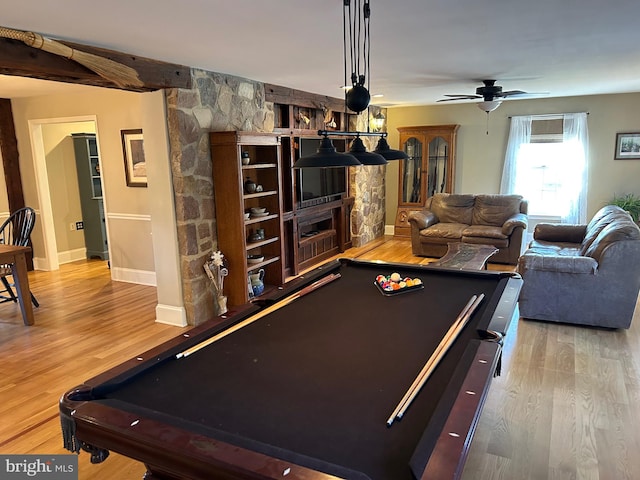 game room with a ceiling fan, billiards, wood finished floors, a fireplace, and baseboards