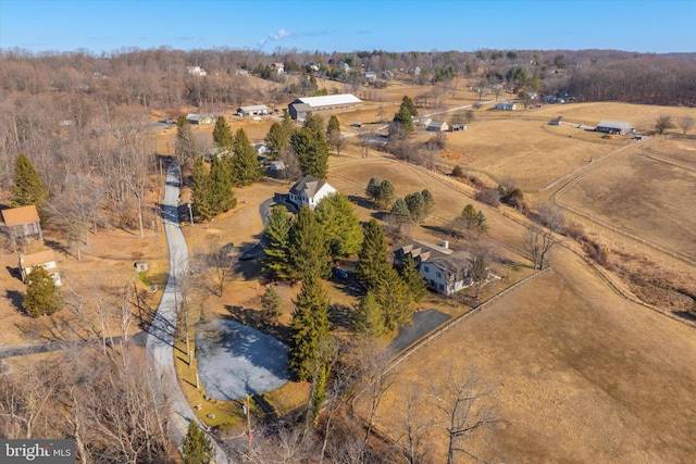 birds eye view of property with a rural view