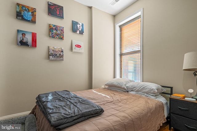 bedroom with multiple windows