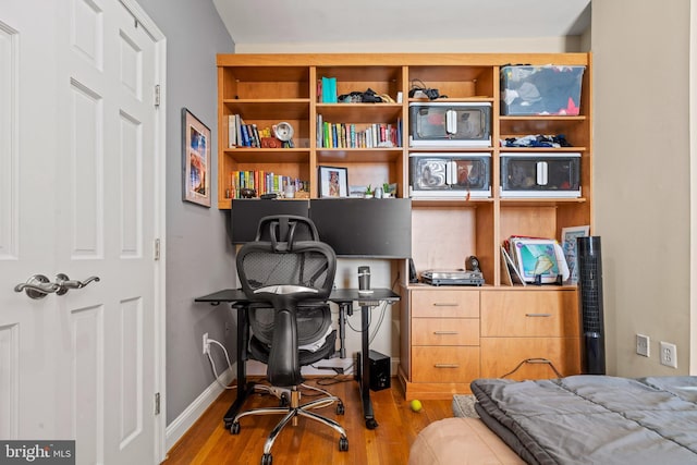 office space with light wood-type flooring